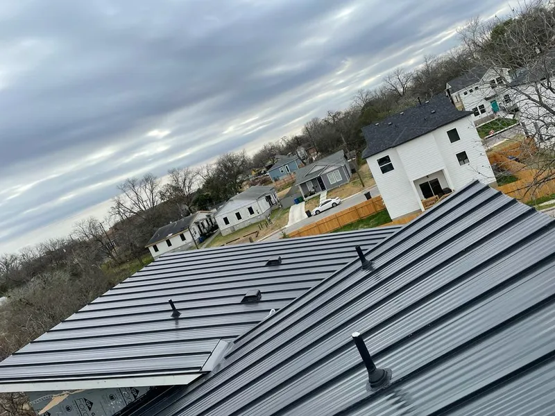 Standing seam metal roof panels with vents for Skylight Repair in Lemont
